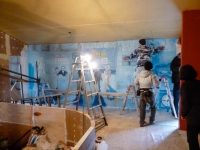 Installation of "The Set Up" mural